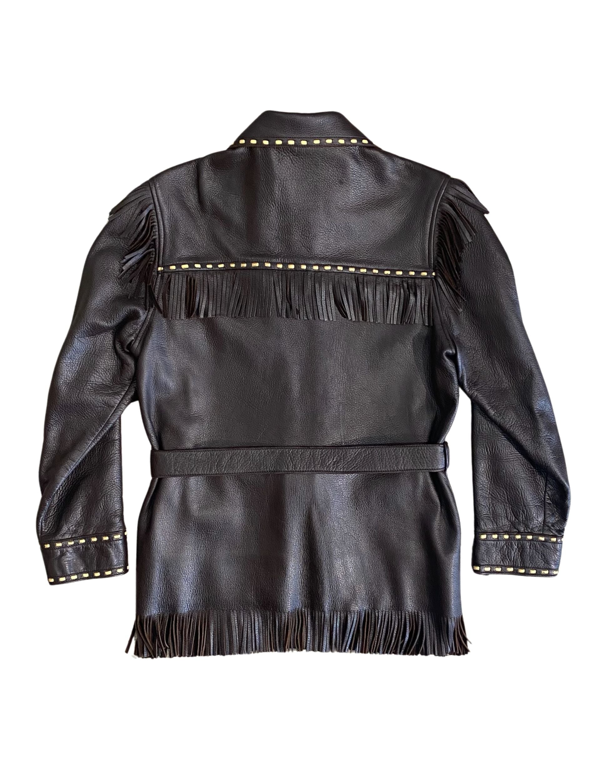 Back view of jacket showing long fringe and belted waist.