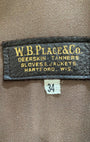 W.B. Place & Co label on a brown fabric background