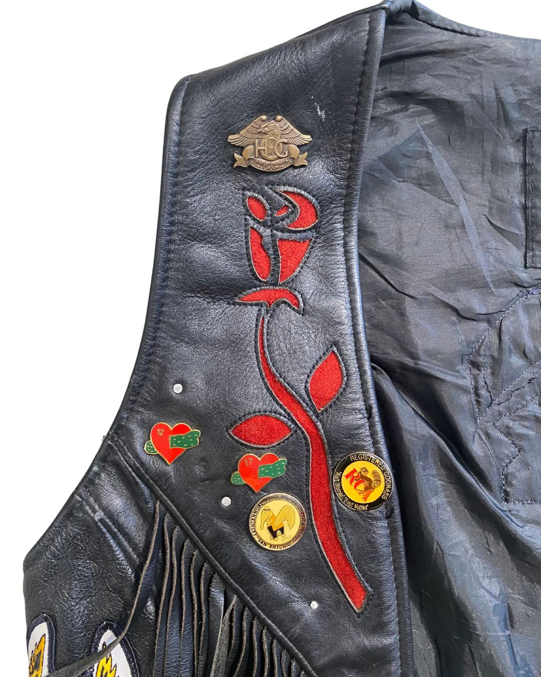 Fringe detail with metal H.O.G, Hearts, Texas charms and red floral embroidery.