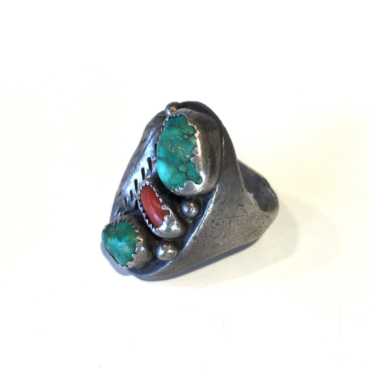 The full view of the right side of the Vintage Native American Turquoise and Coral Silver Ring.