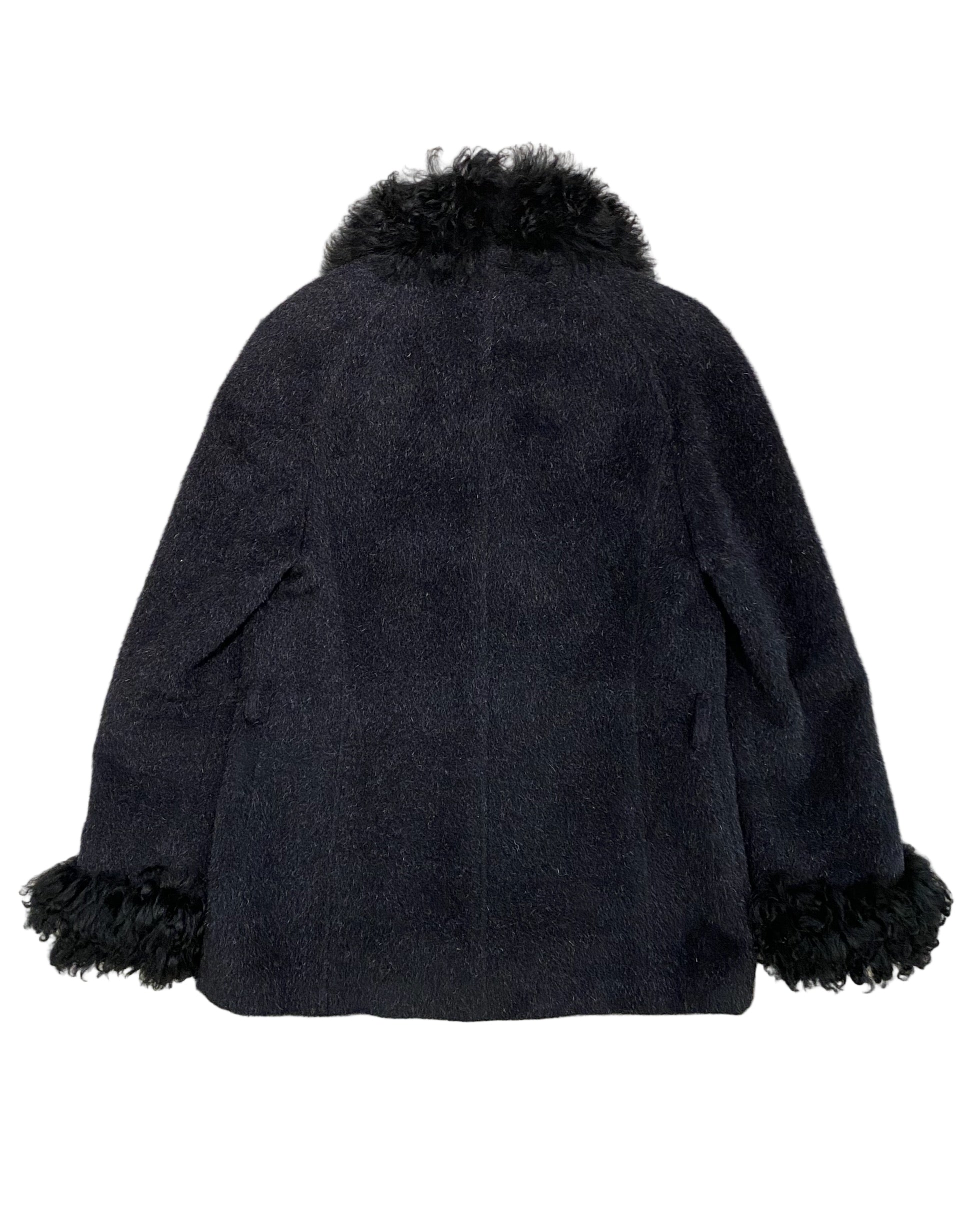 Back view of vintage Georges Rech coat showing black wool texture and dramatic fur-trimmed collar and cuffs.