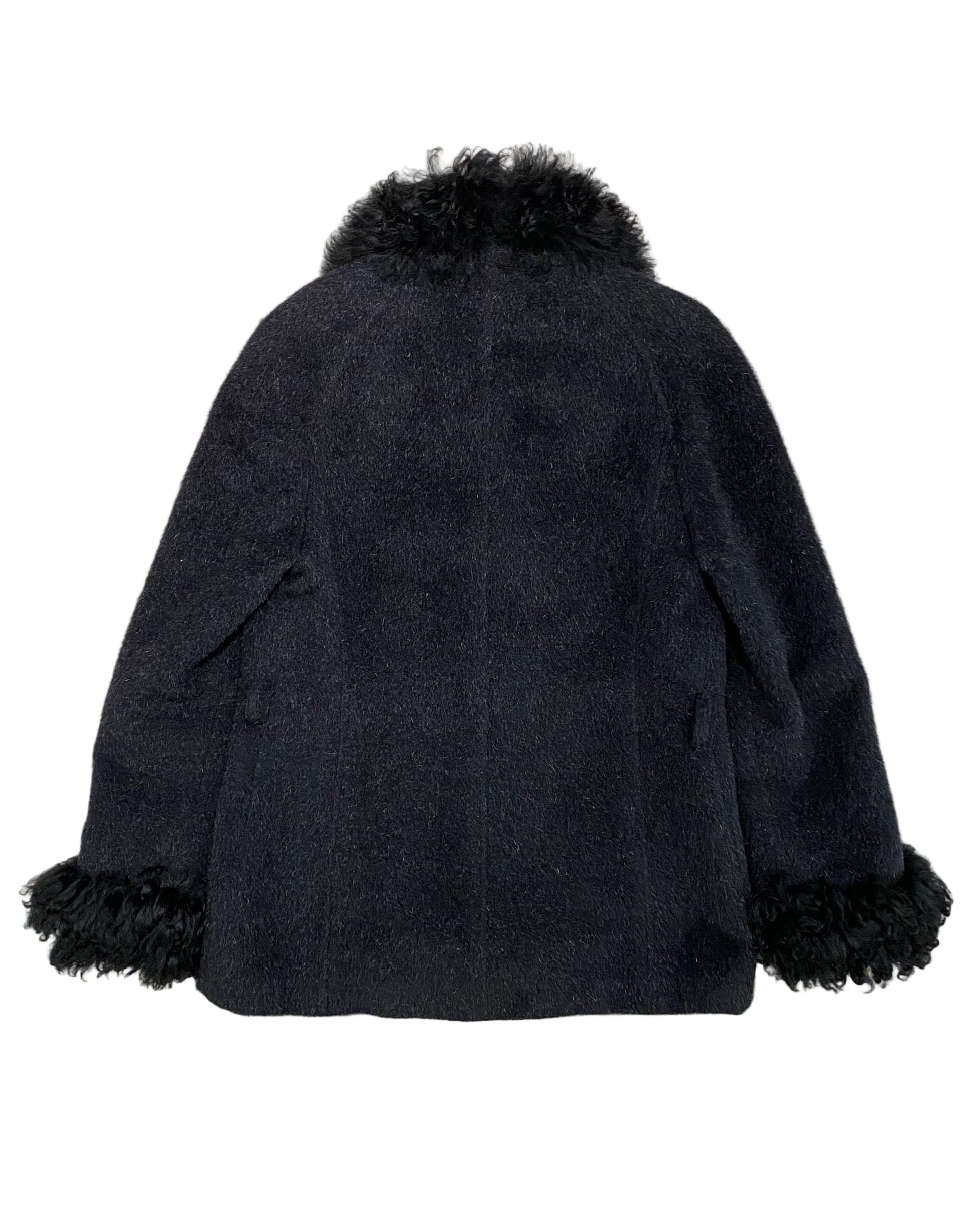 Back view of vintage Georges Rech coat showing black wool texture and dramatic fur-trimmed collar and cuffs.