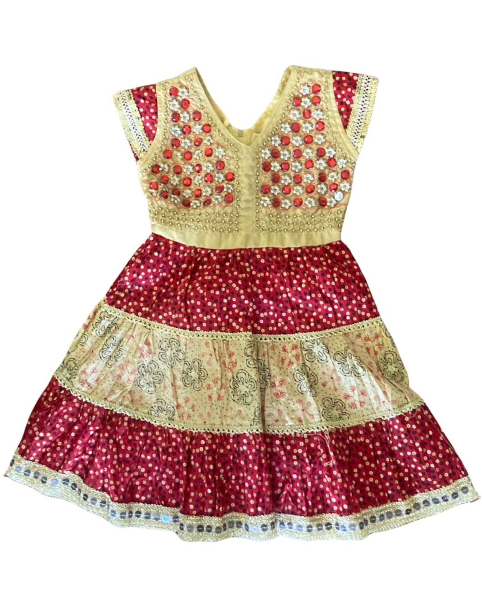 Front view of handmade 1960s girls' dress with sequins and tiered skirt.