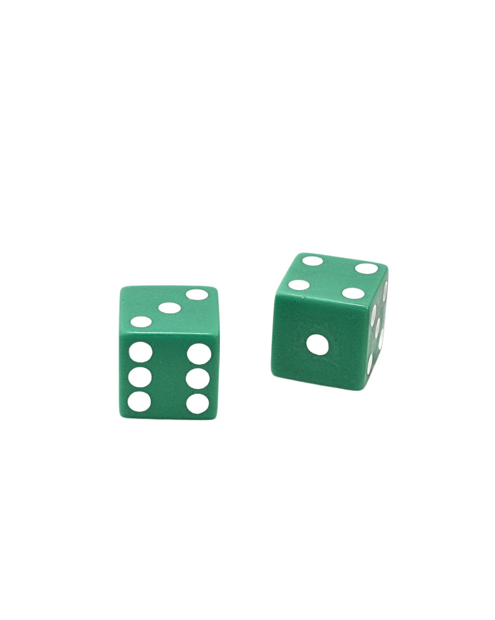 Close-up of two green dice with white pips.