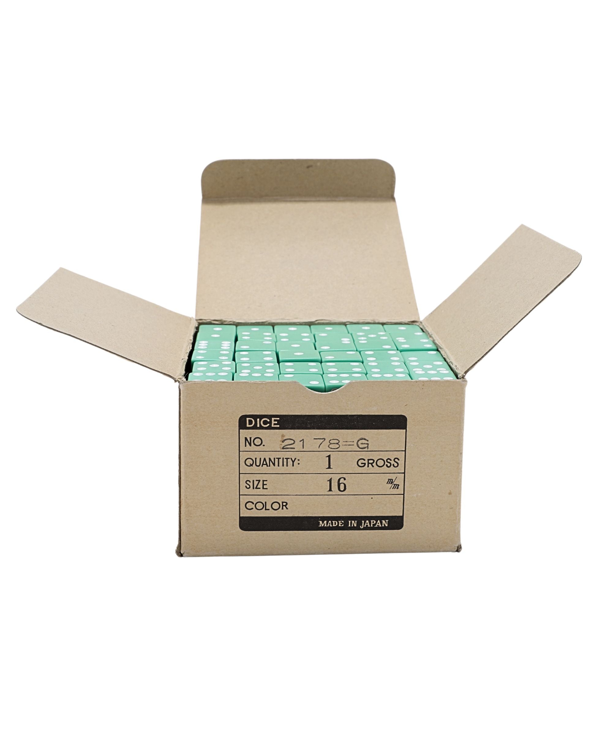 Open box showing rows of vintage green dice.