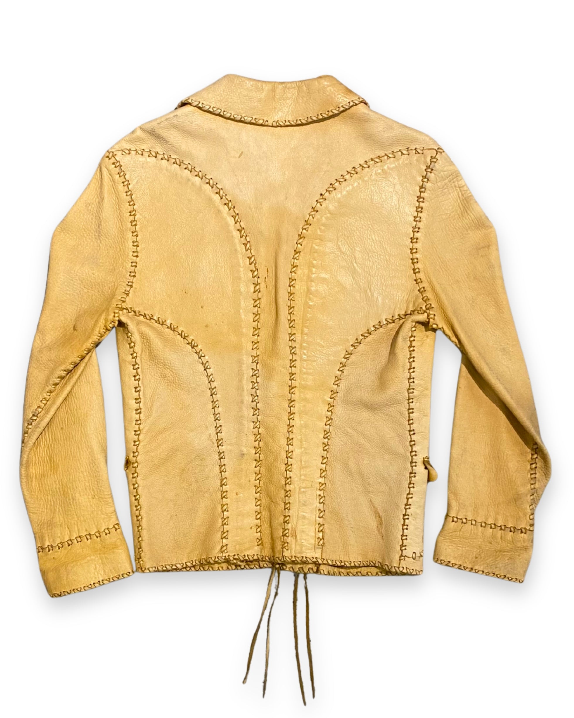 Back view of vintage tan buckskin leather jacket with stitched panel construction.