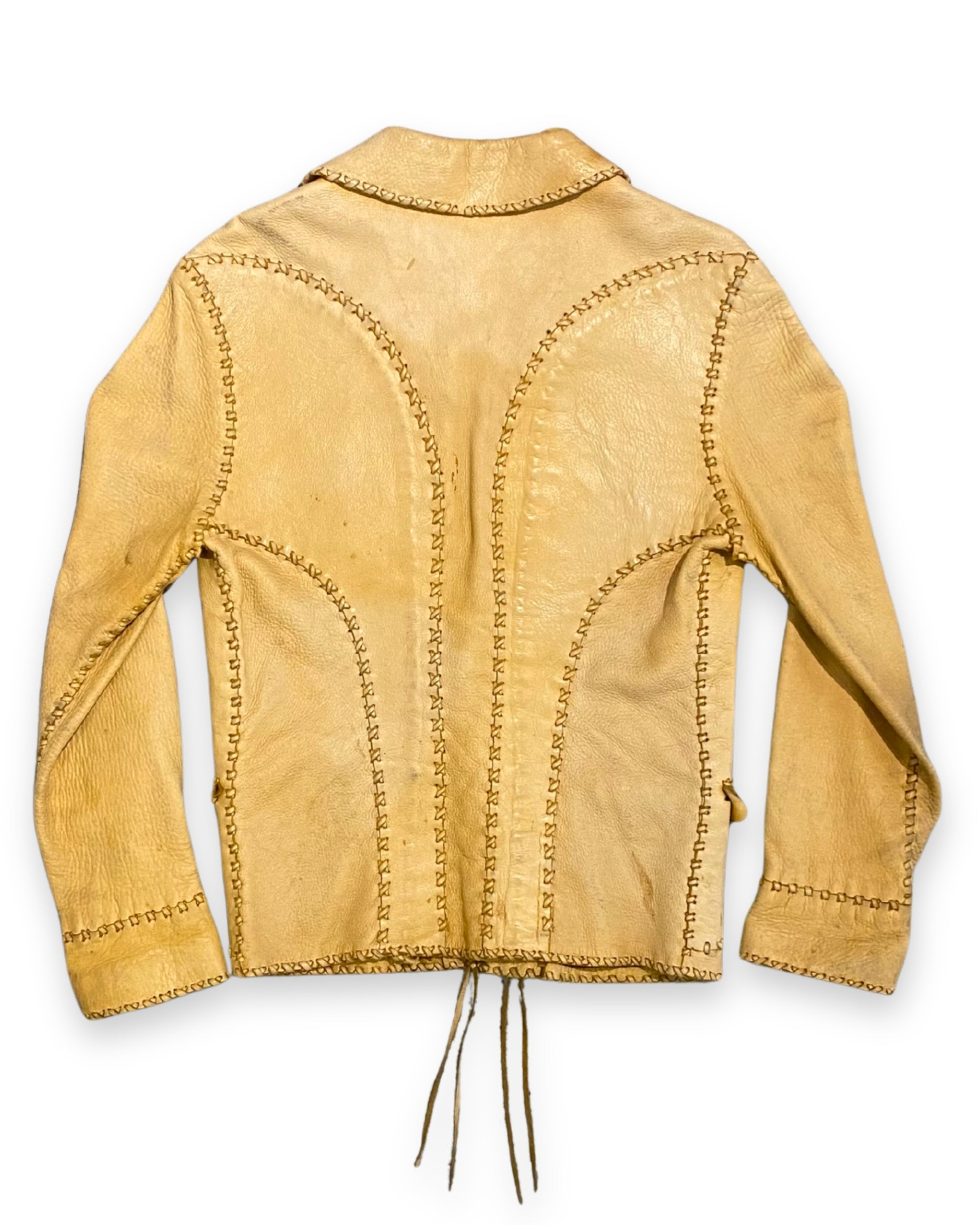 Back view of vintage tan buckskin leather jacket with stitched panel construction.