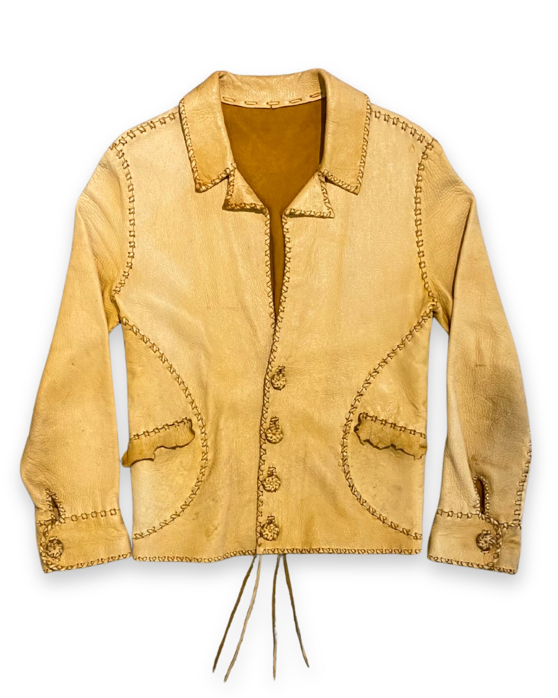 Front view of handmade 1970s tan buckskin leather jacket with decorative stitching and button front.