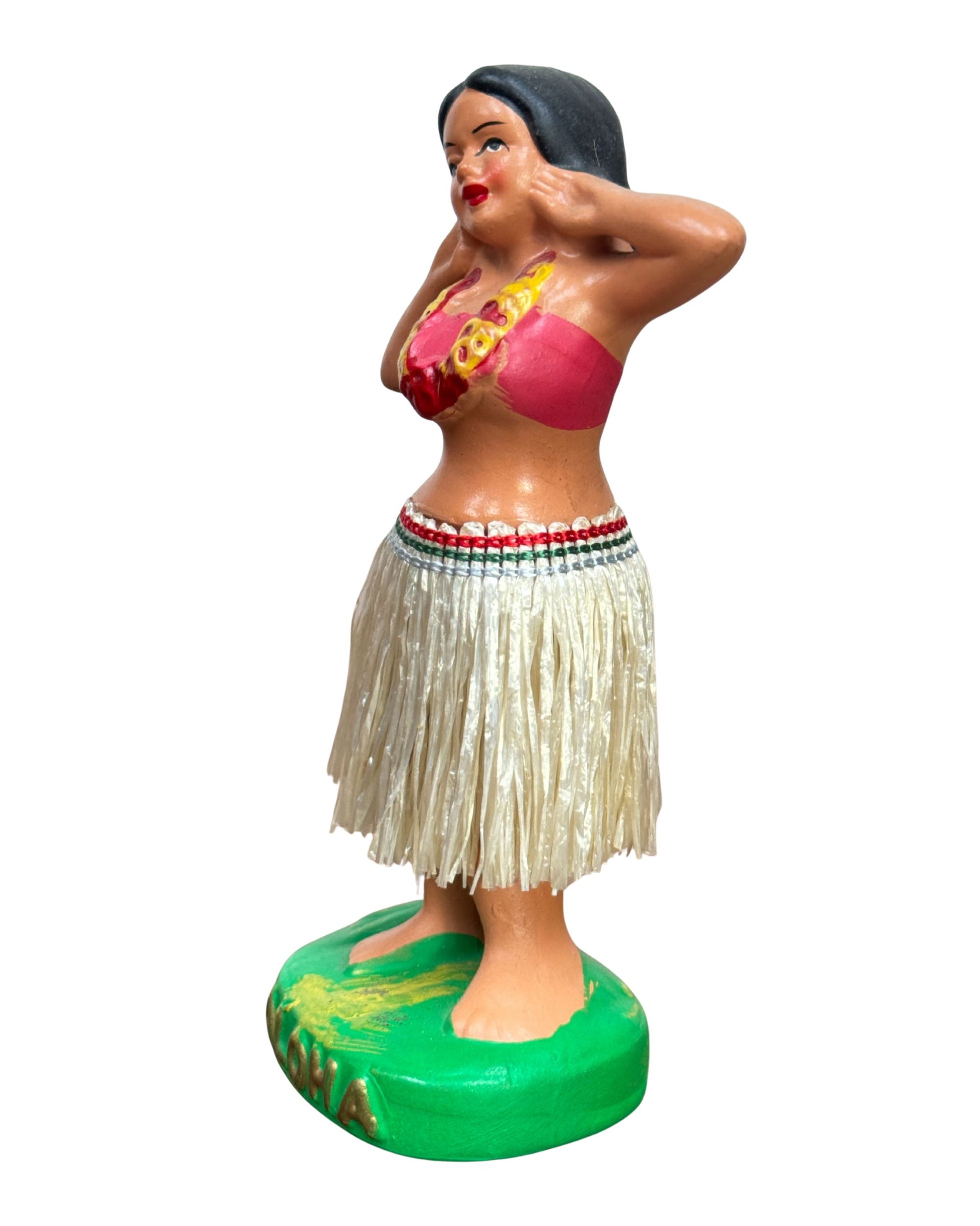Side view of Vintage Hula Girl dancer nodder with straw skirt and red top.