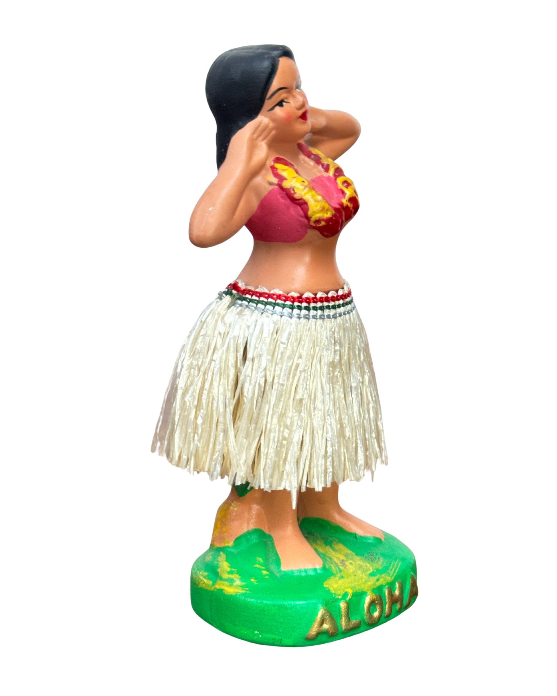 Side view of Vintage Hula Girl dancer nodder with straw skirt and red top.