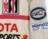 The upclose view of the patches on the Juan Manuel Fangio II Auto Racing Suit.