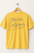 California Gold Surfing Cowboys Kick Ass high crew T-shirt with vaquero and donkey front graphic and Malibu California back print. Back View.
