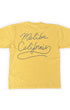 Back of Surfing Cowboys Kick Ass high crew T-shirt in California Gold with Malibu California lasso-script graphic.