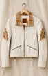 Creamy White jacket with plaid accents on a beige hanger against a beige background