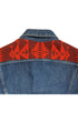 • Close-up view of the red Southwestern style wool pattern stitched onto the back yoke of a casual 1970s Lee indigo denim jacket.
