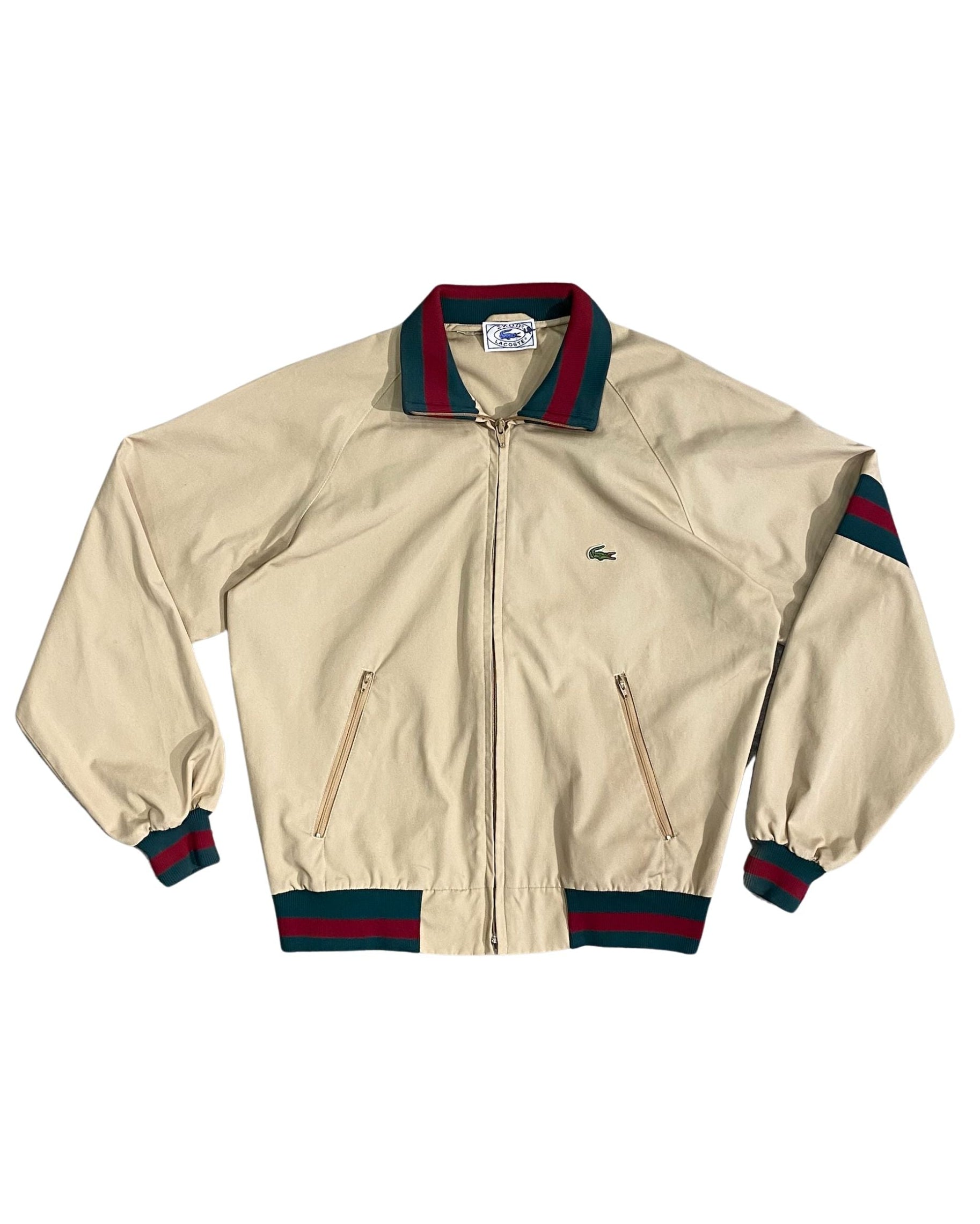 Front view of 1970s Izod Lacoste jacket with green and red trim.