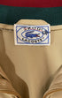 Close-up of blue label on vintage Izod Lacoste jacket.