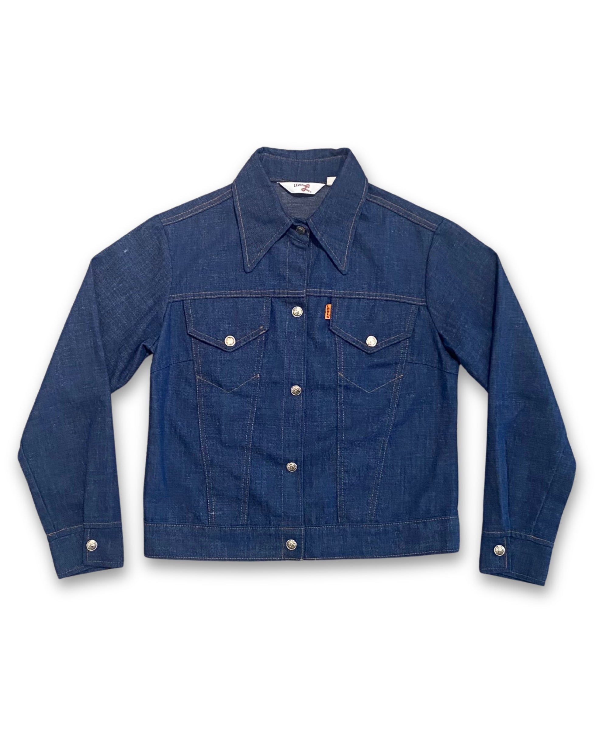 Front view of vintage 1970s Levi’s Orange Tab denim jacket with dark indigo wash and snap closure.