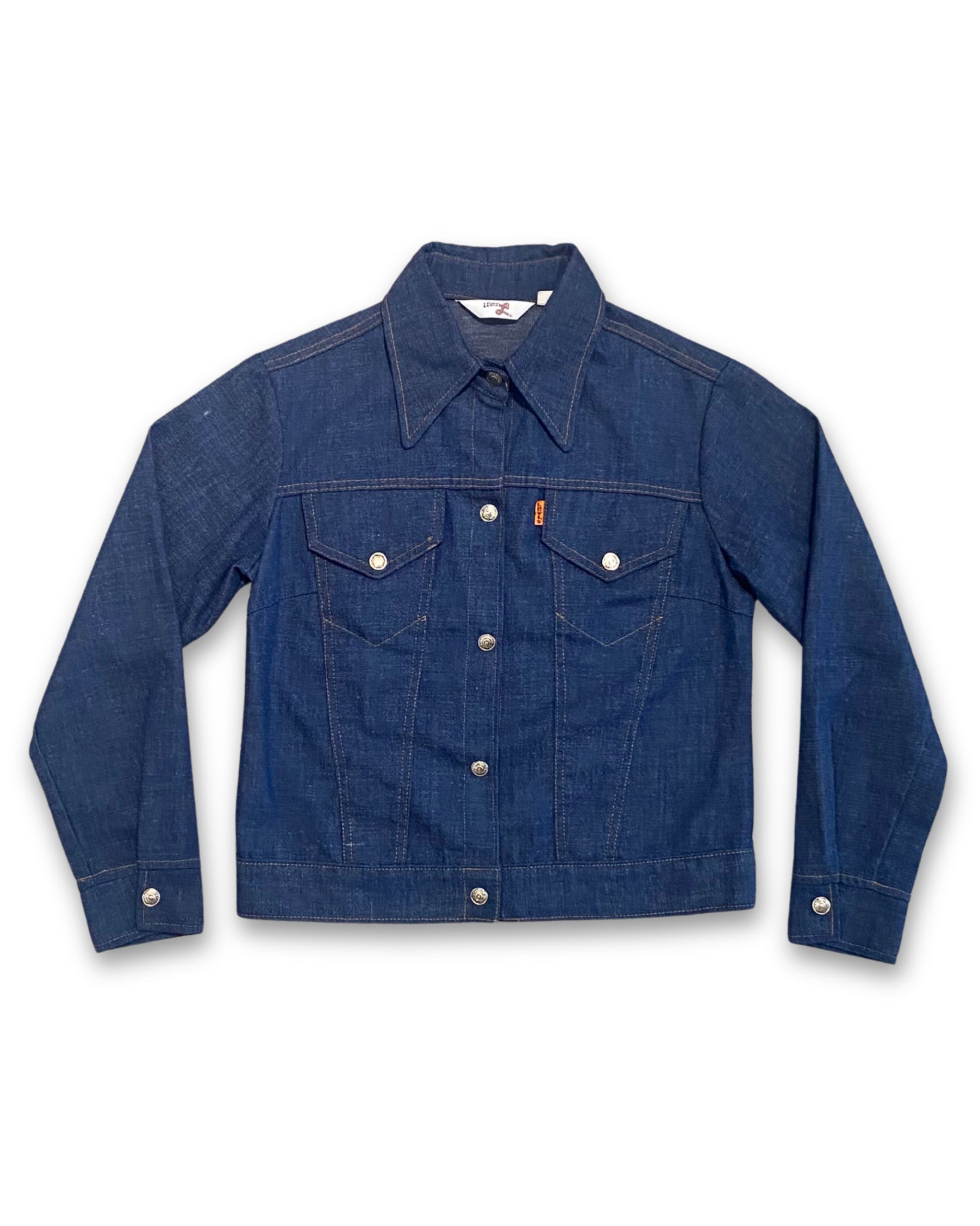 Front view of vintage 1970s Levi’s Orange Tab denim jacket with dark indigo wash and snap closure.