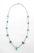 Silver Heishi  and Turquoise Nugget Strand Necklace 1970s on white background.