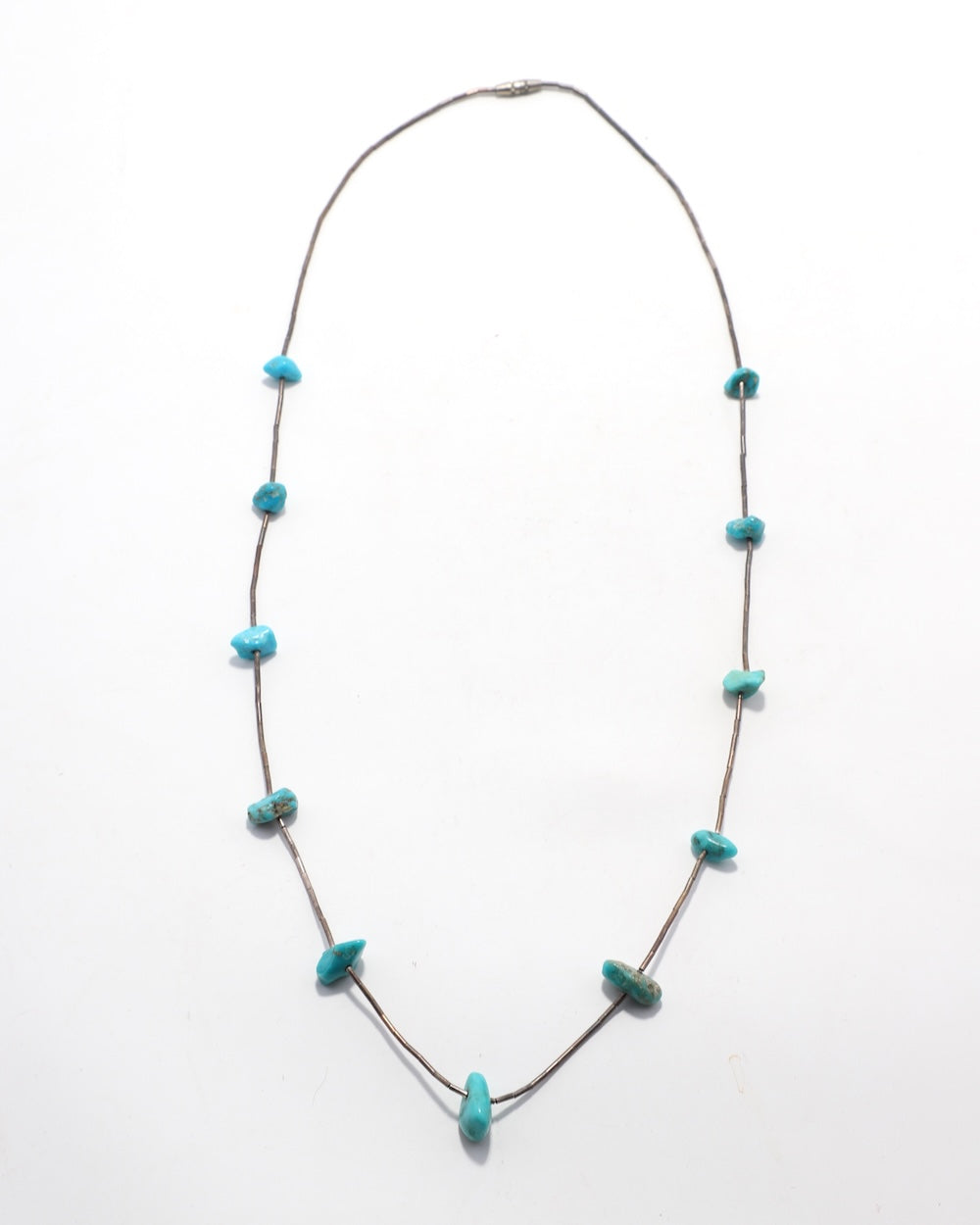 Silver Heishi  and Turquoise Nugget Strand Necklace 1970s on white background.