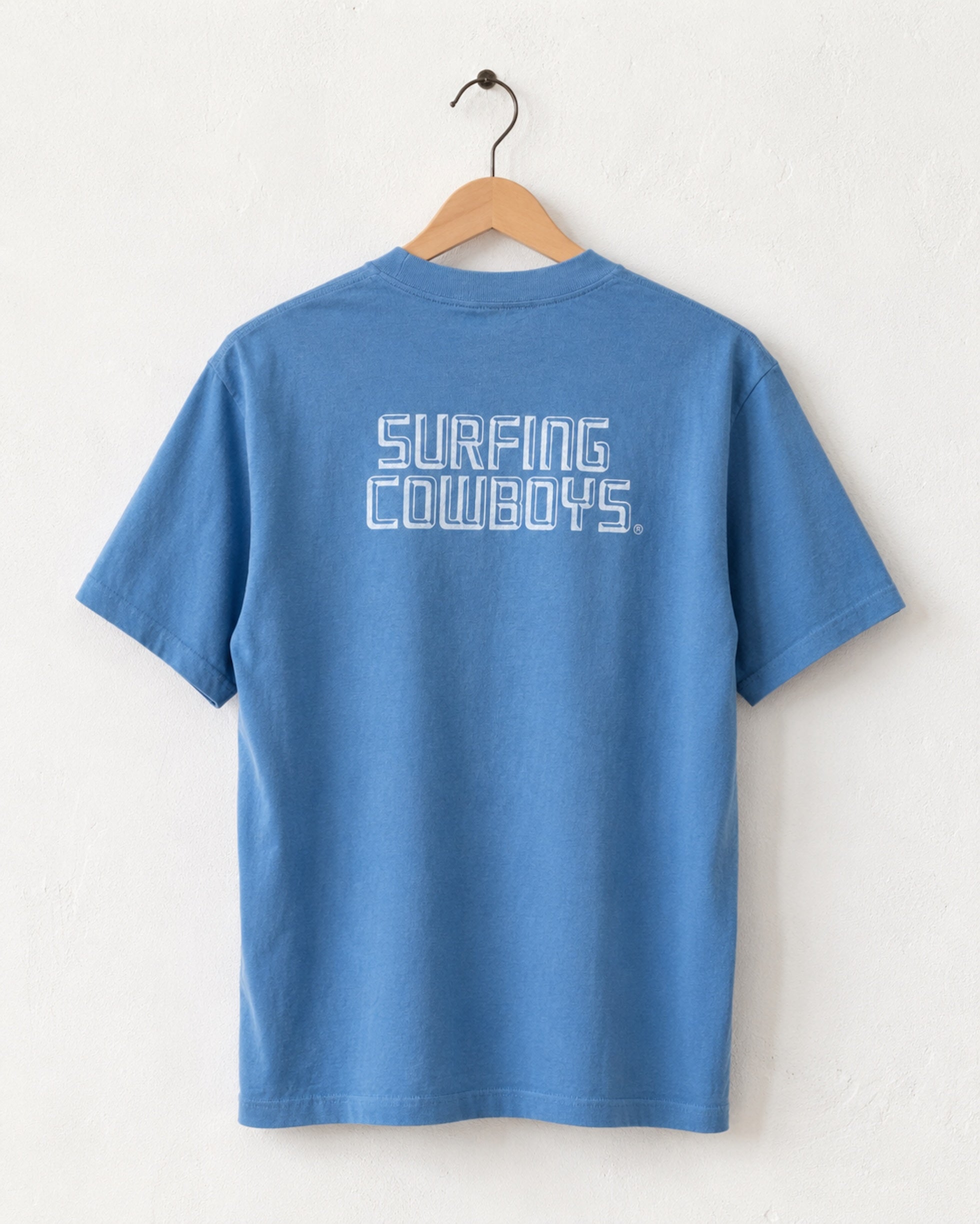 Back of Surfing Cowboys High Crew Cotton Logo T-Shirt in blue - back view of center back logo placement printed logo in soft white.