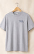 Front of Logo T in Heather Grey hanging on hanger with Surfing Cowboys Logo on chest 