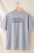 Back of Logo T in Heather Grey hanging on hanger with Surfing Cowboys Logo on center back.