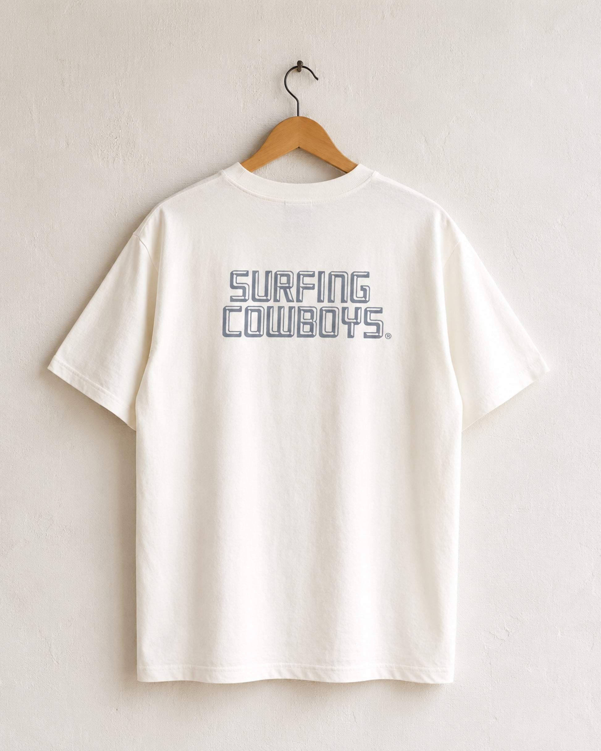 Back of Surfing Cowboys High Crew Cotton Logo T-Shirt in cloud White - back view of center back logo placement printed logo in faded indigo blue.