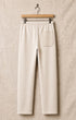 Surfing Cowboys® Surf + Track loopback cotton patch pants in natural, back view, with drawstring waist, stitched patch pocket.