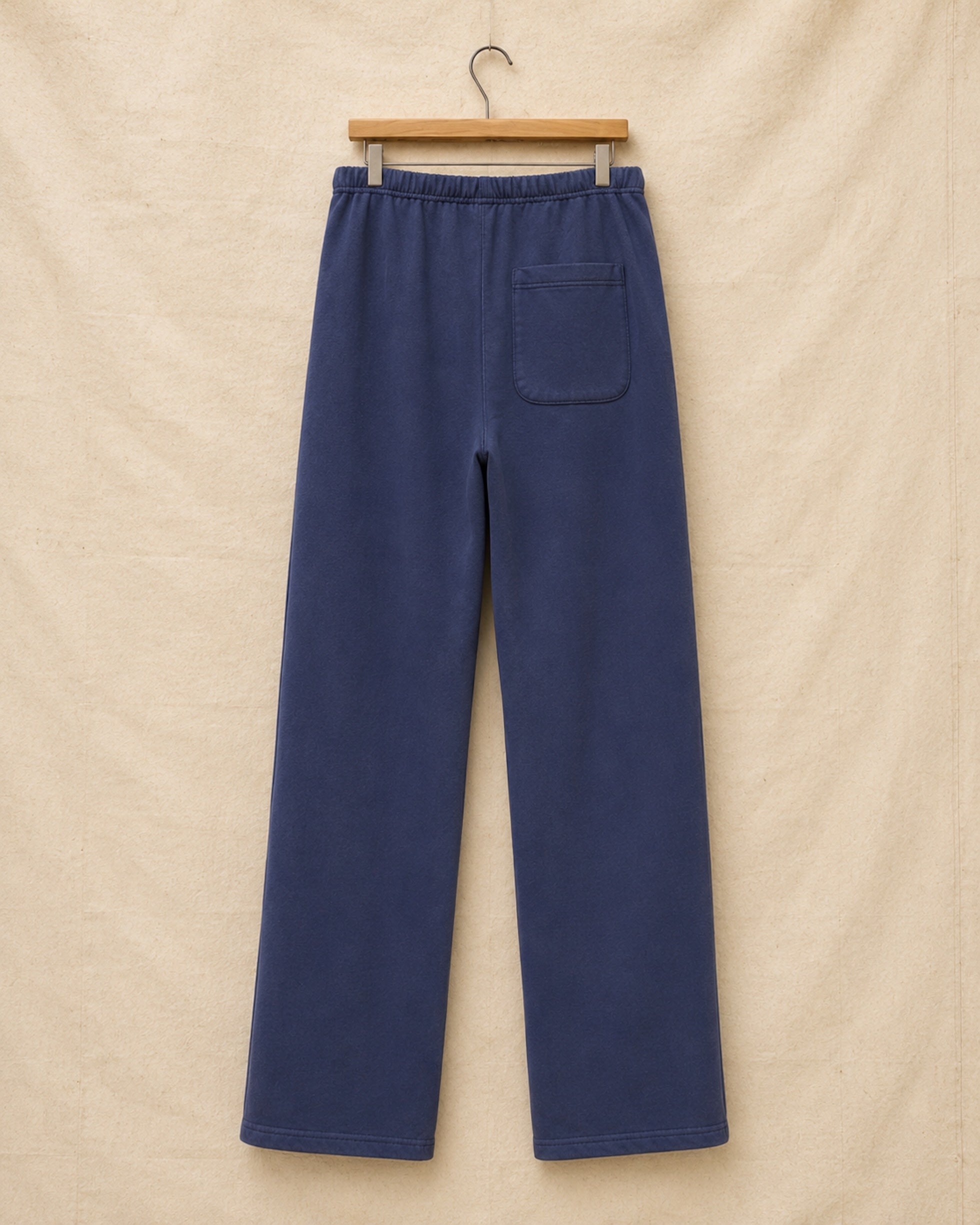Surfing Cowboys® Weekender loopback cotton pants in washed navy, back view, with single patch pocket.
