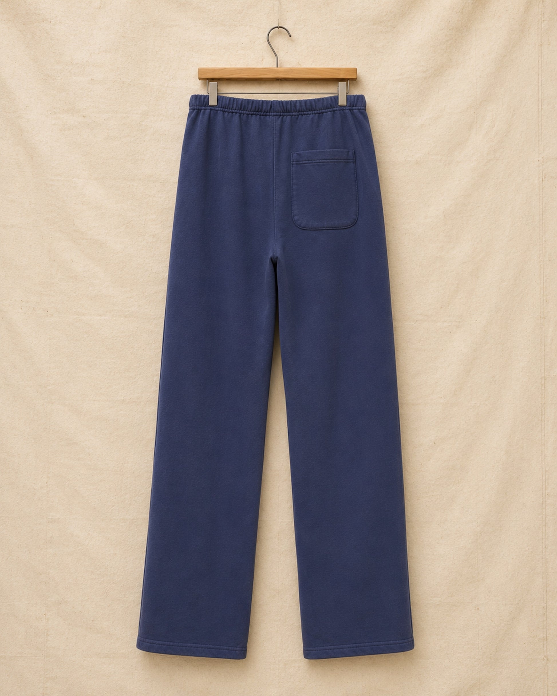 Surfing Cowboys® Weekender loopback cotton pants in washed navy, back view, with single patch pocket.
