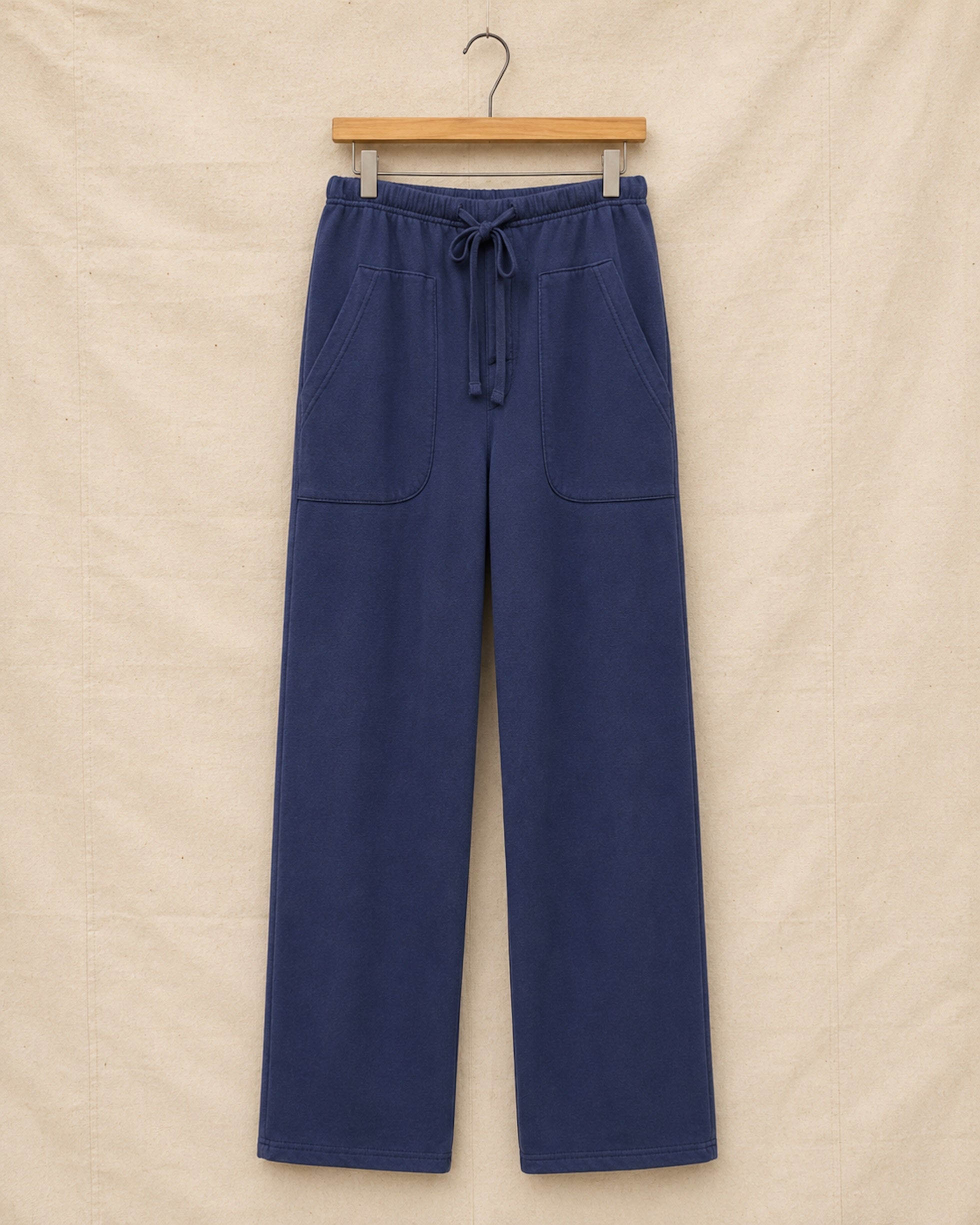 Surfing Cowboys Weekender loopback cotton pants in washed navy, front view, with drawstring waist and oversized patch pockets.