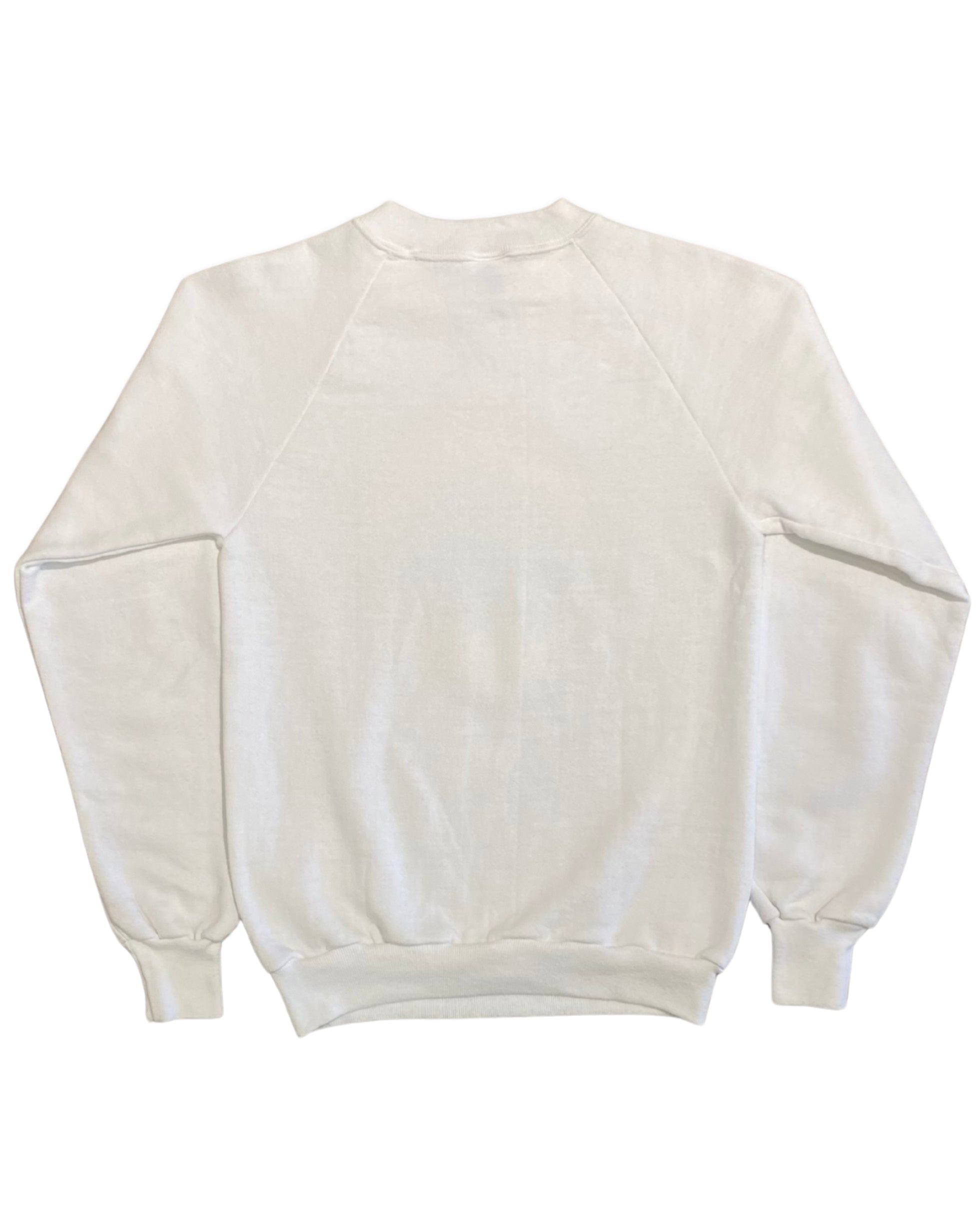 Back view of a vintage white 1980s raglan sweatshirt with a plain back and ribbed waistband and cuffs.