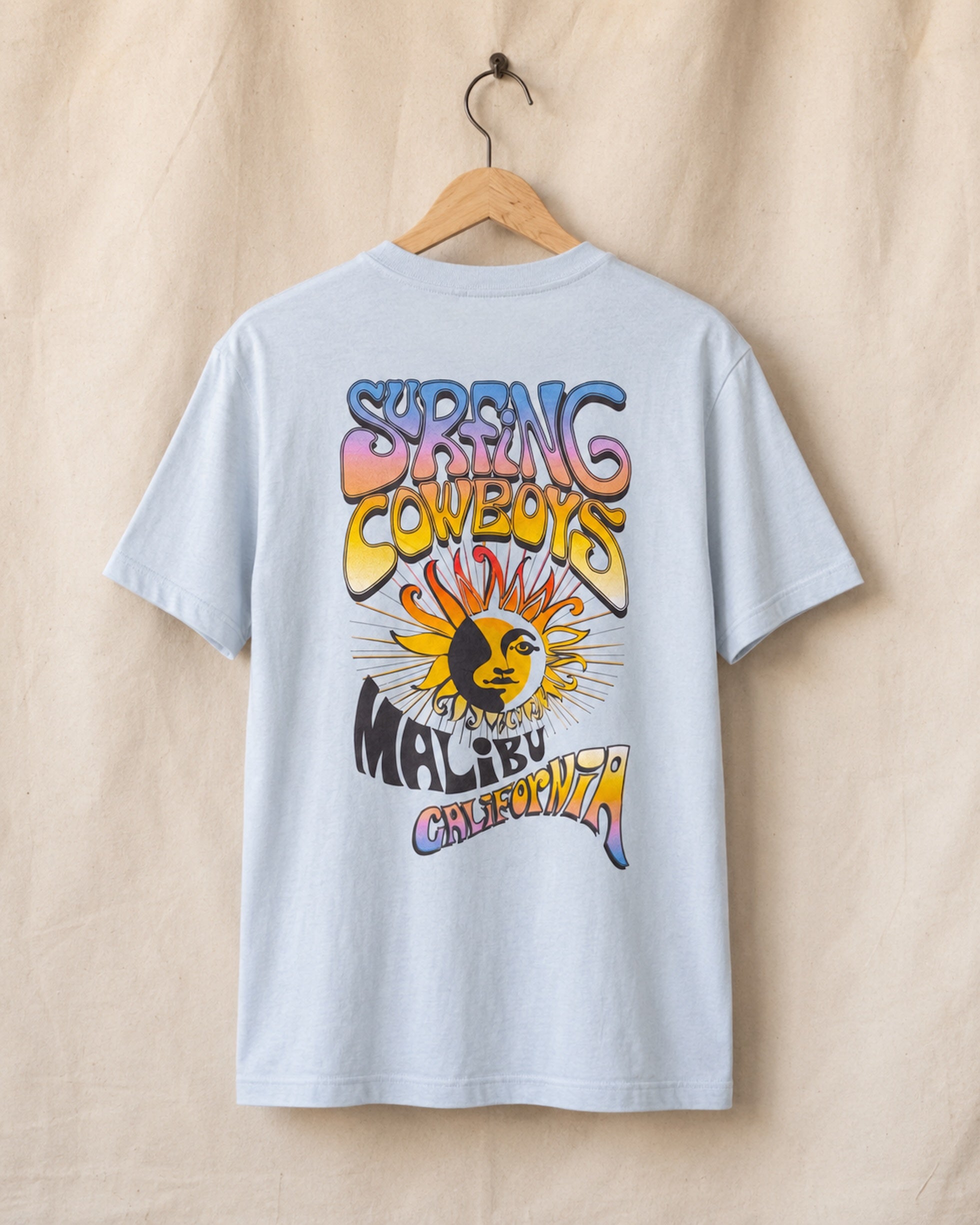 Back view of Sky Blue Surfing Cowboys Lowrider Sun classic T-shirt with full-color Malibu California sun back print.