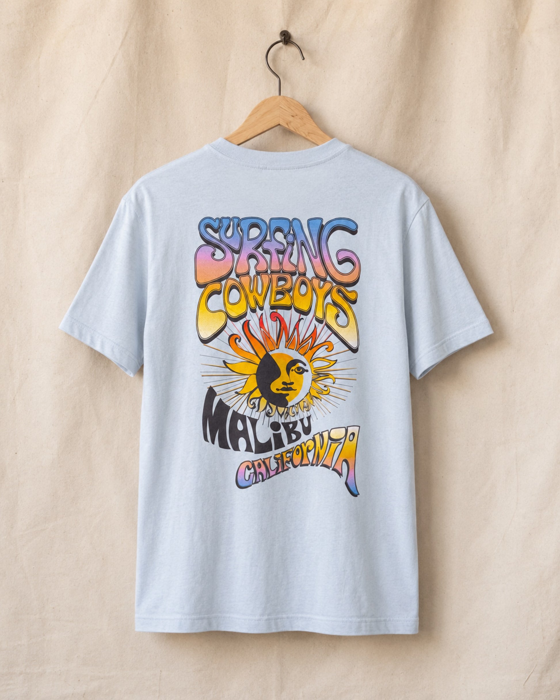 Back view of Sky Blue Surfing Cowboys Lowrider Sun classic T-shirt with full-color Malibu California sun back print.