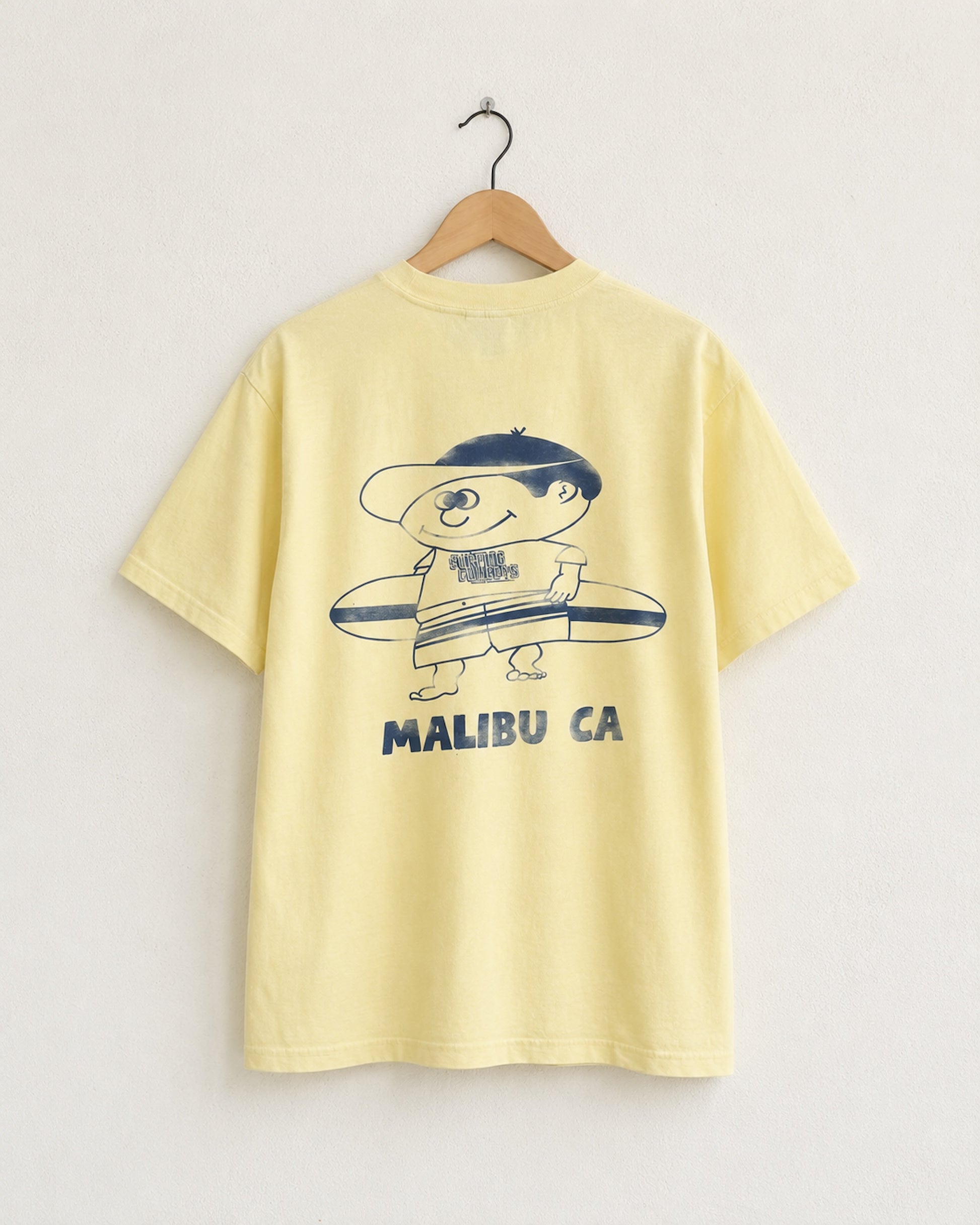 Surfing Cowboys Making Waves High Crew Pocket T-Shirt with graphic back view featuring surfer boy with board.