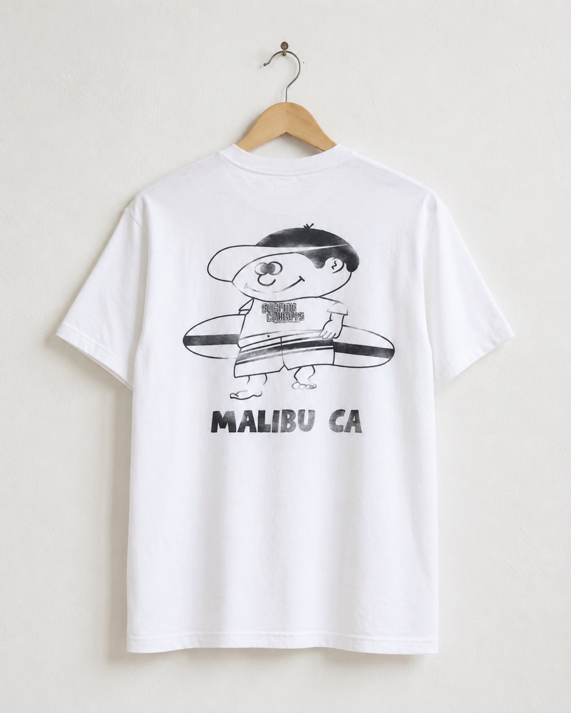 Surfing Cowboys Making Waves High Crew Pocket T-Shirt in white on hanger displaying back view featuring graphic of surfer boy.