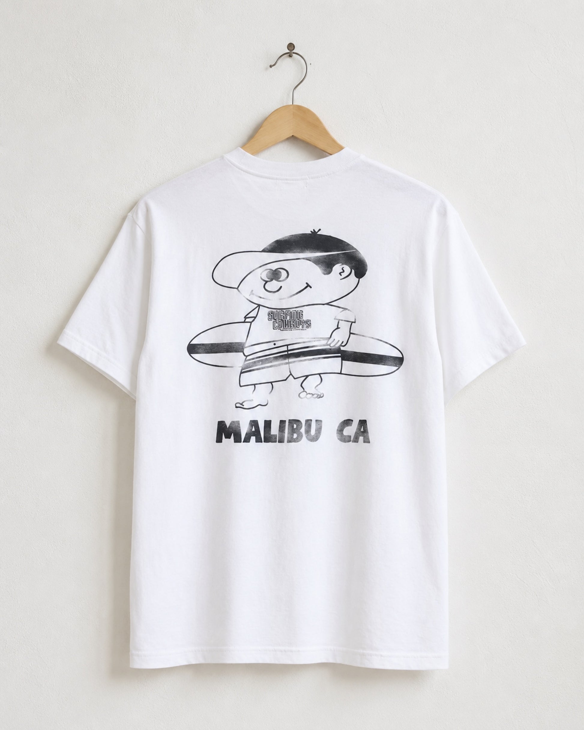 Surfing Cowboys Making Waves High Crew Pocket T-Shirt in white on hanger displaying back view featuring graphic of surfer boy.