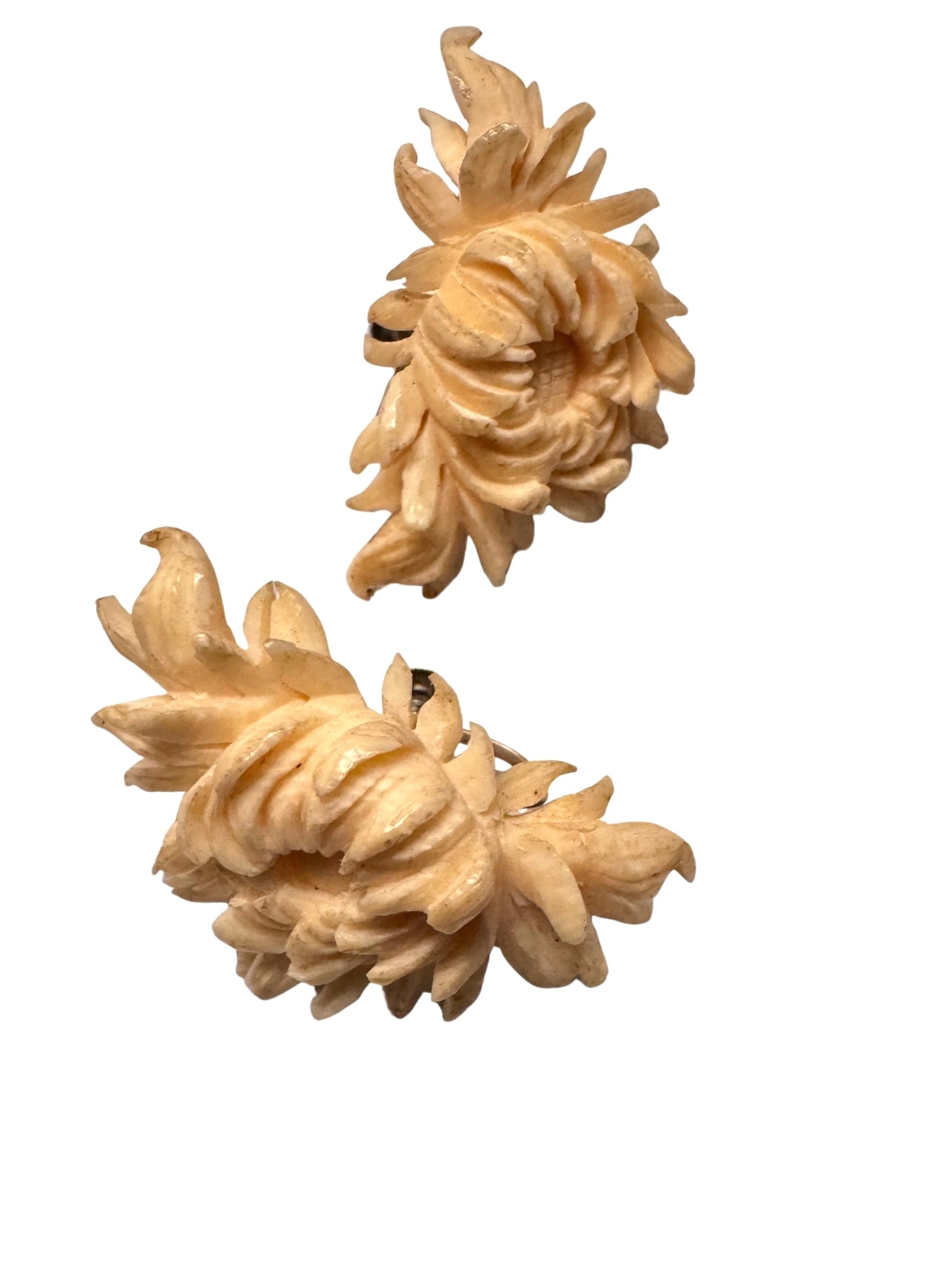 Vintage carved floral earrings attributed to Ming’s of Hawaii on white background.
