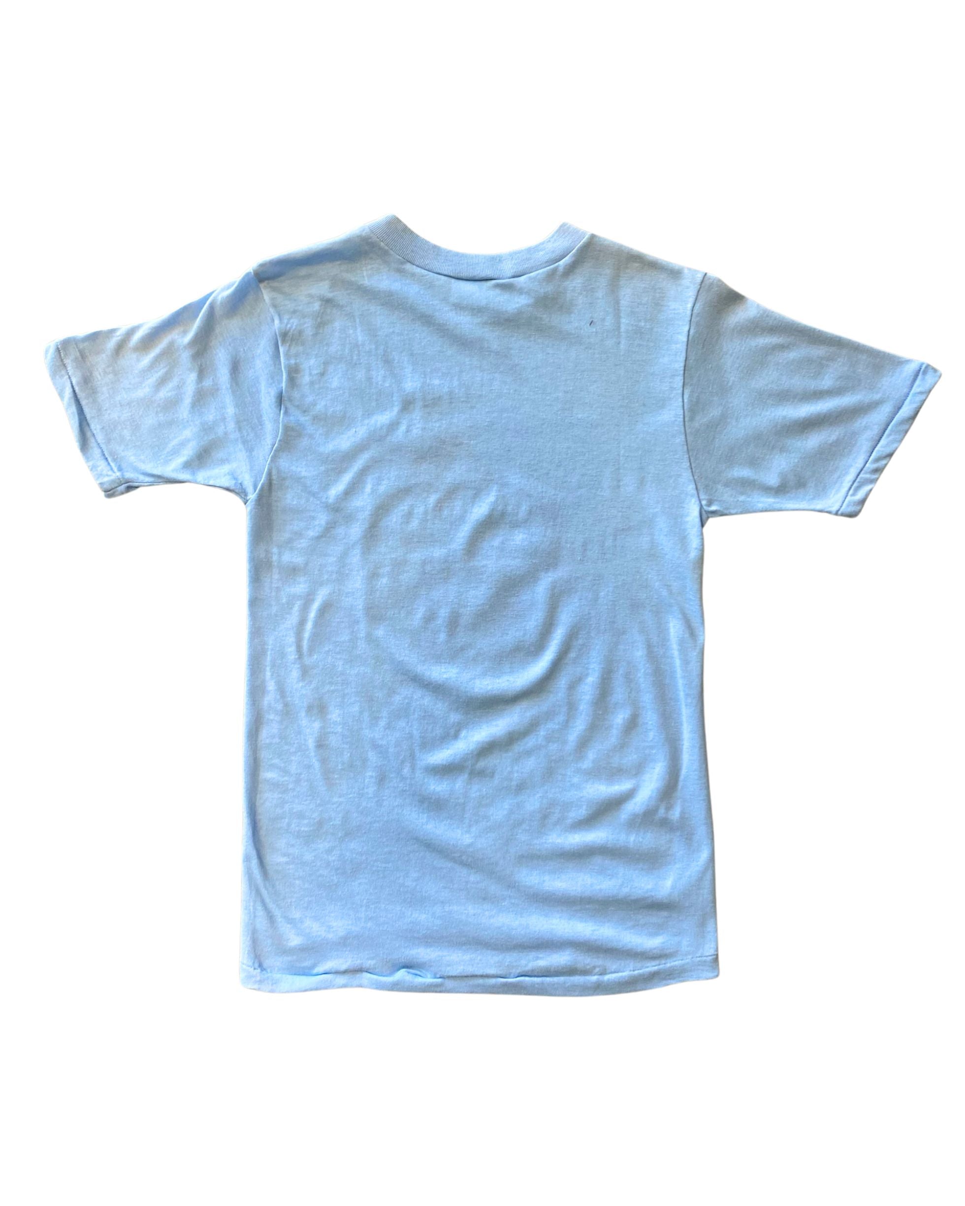 Back of solid blue t-shirt .