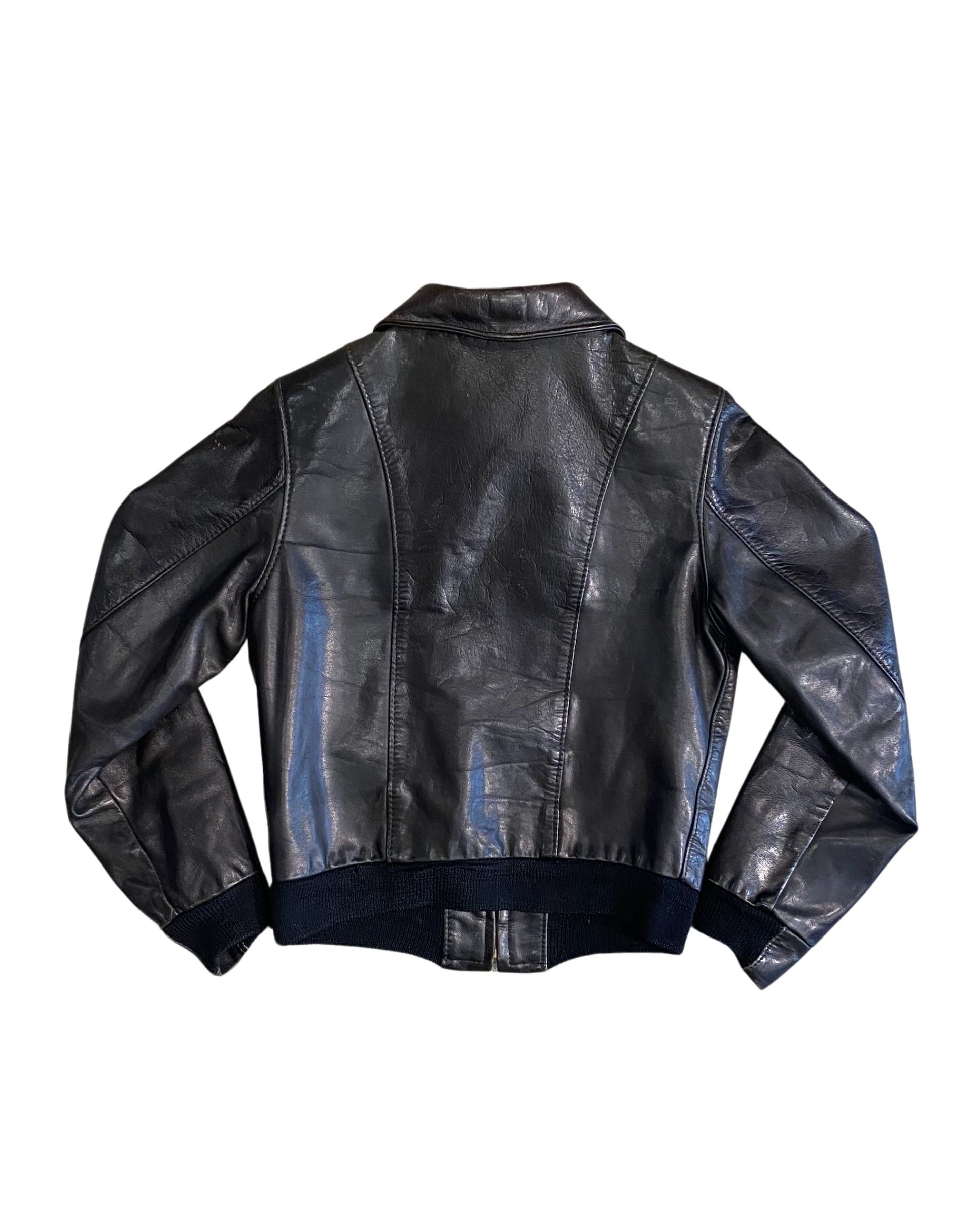 Back of black 1980s North Beach Leather jacket showing double seams.