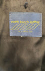 Interior label showing “North Beach Leather, San Francisco.”