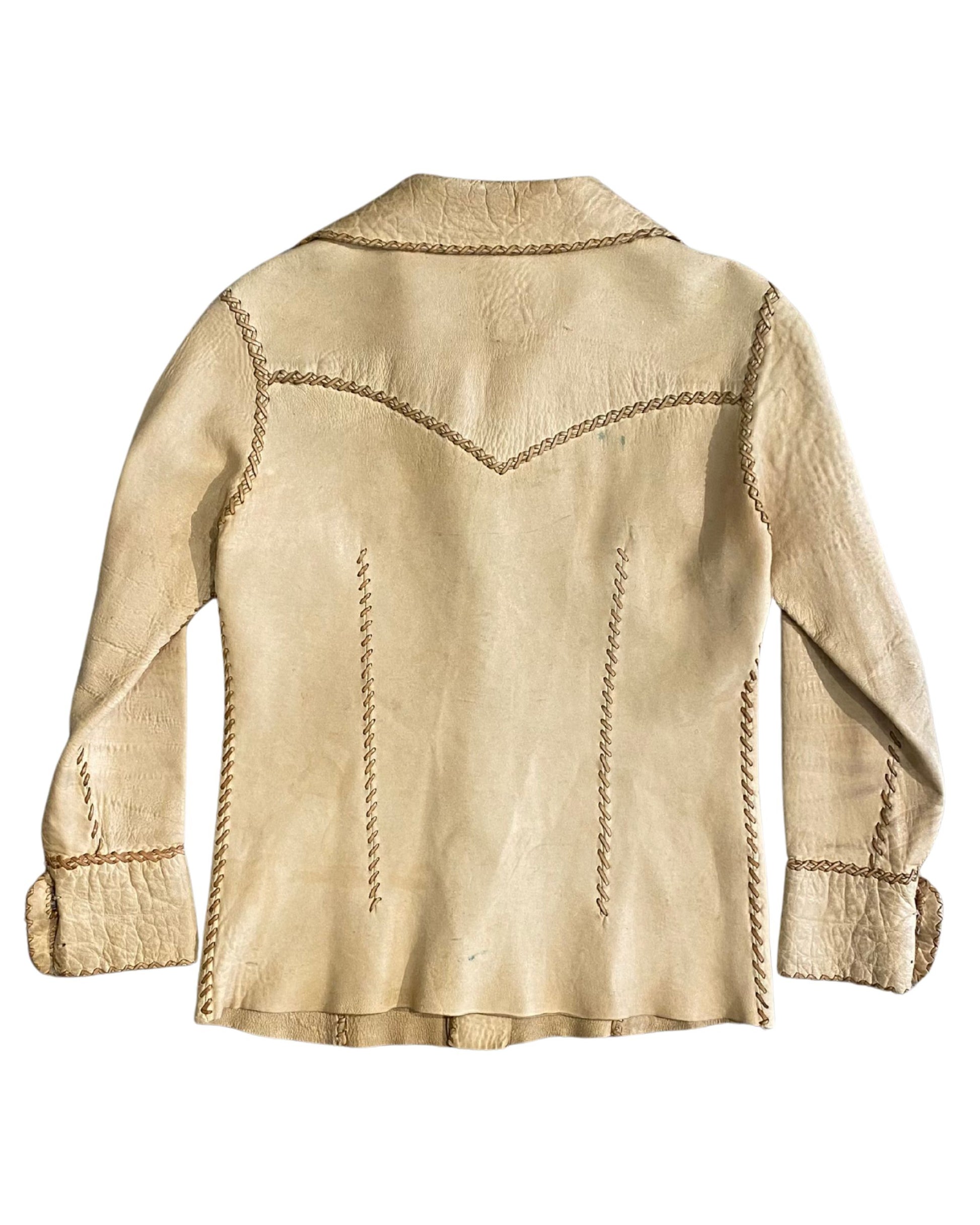Back view of cream-colored leather shirt-jacket with wide 70s collar and stitched accents.