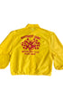 Back view of yellow jacket with red ram and checkered flag logo.

