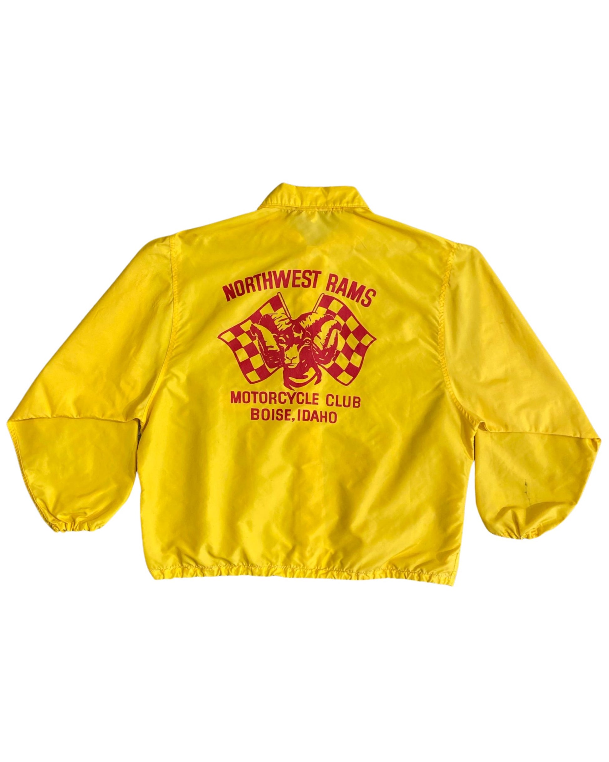 Back view of yellow jacket with red ram and checkered flag logo.
