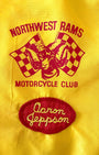 Close-up of embroidered “Aaron Jeppson” name patch on vintage motorcycle jacket.
