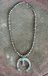 Front of Old Pawn Silver Bead Necklace with Removable Turquoise Naja — Circa 1970s on rustic metal table top.