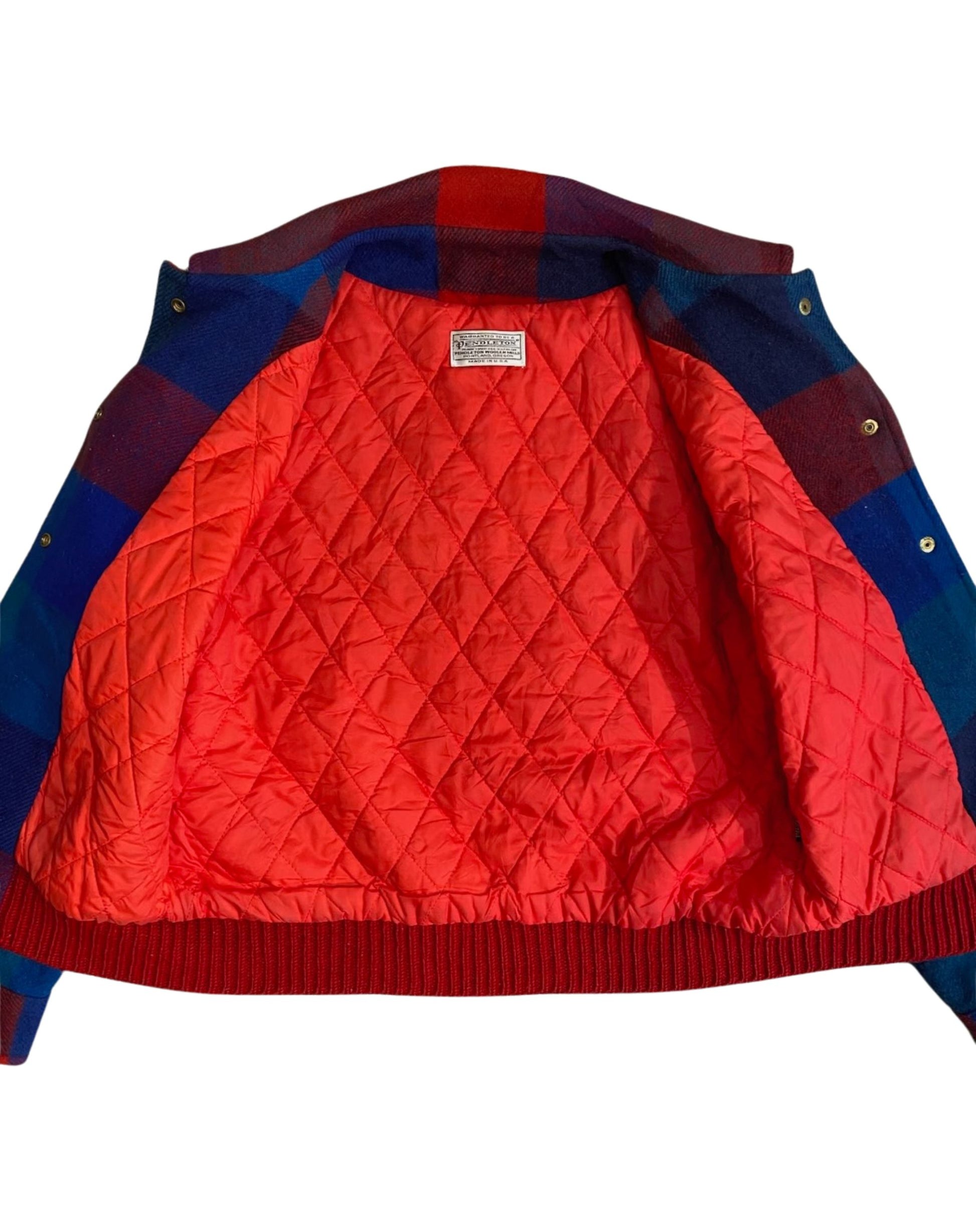 Interior quilted lining of Pendleton plaid jacket, bright red.