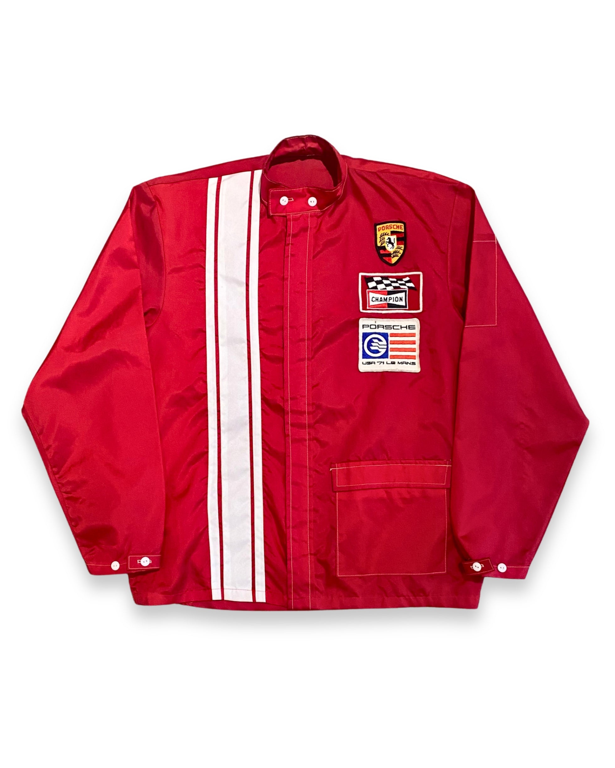 Front view of vintage Porsche Le Mans racing jacket in red with white racing stripes and patches.
